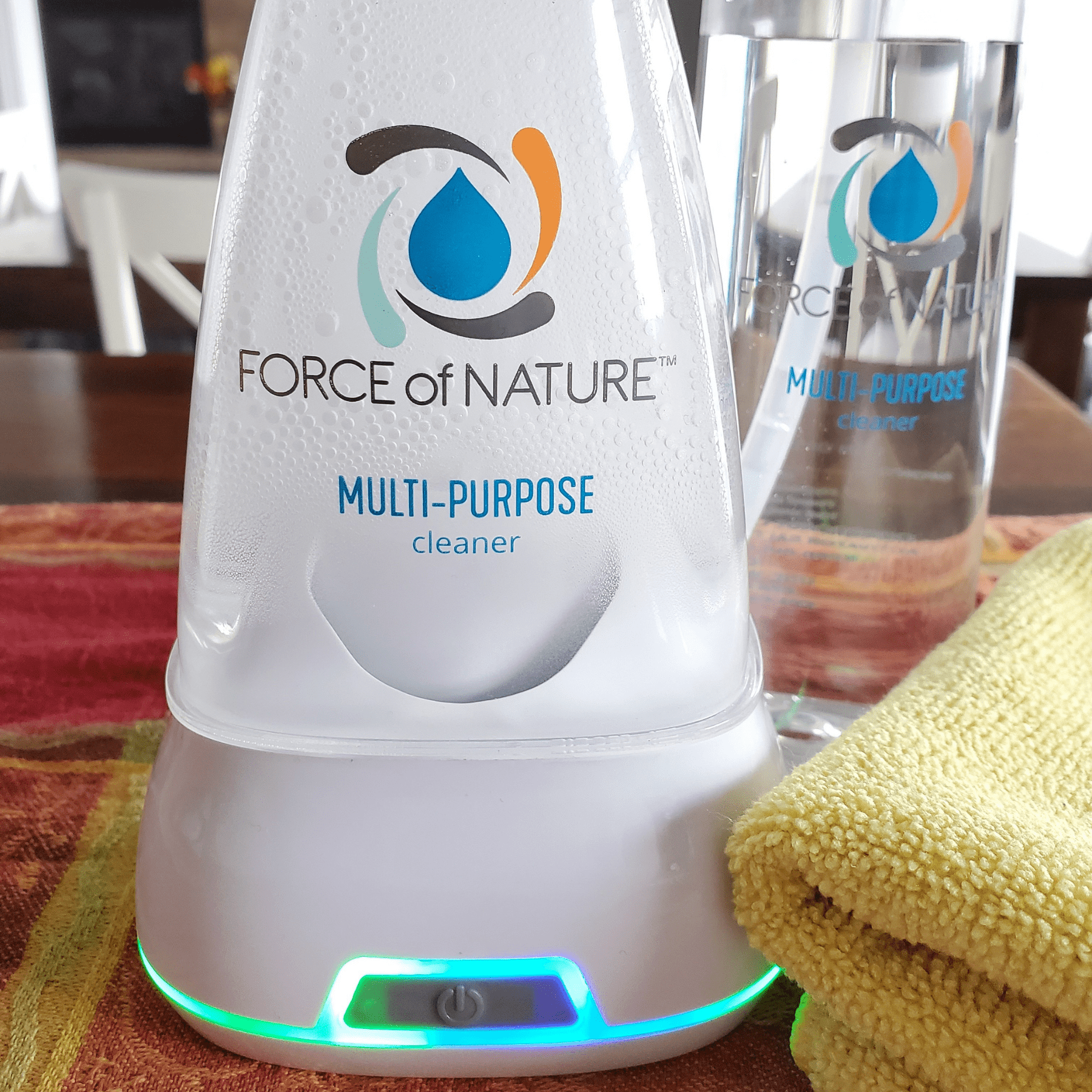Force of Nature non-toxic cleaner bottle and electrolyzer base sitting on a kitchen countertop